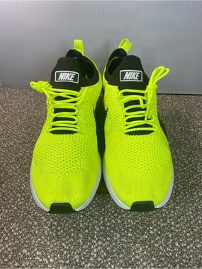 Nike Air Zoom Flyknit Racer Sneakers Mariah in a Bright Volt Yellow Color.